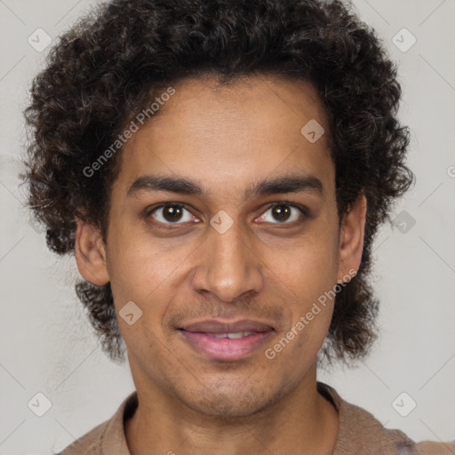 Joyful black young-adult male with short  brown hair and brown eyes