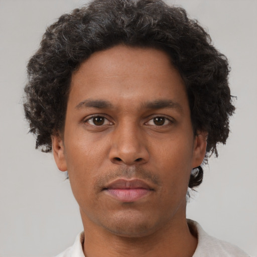 Neutral black young-adult male with short  brown hair and brown eyes