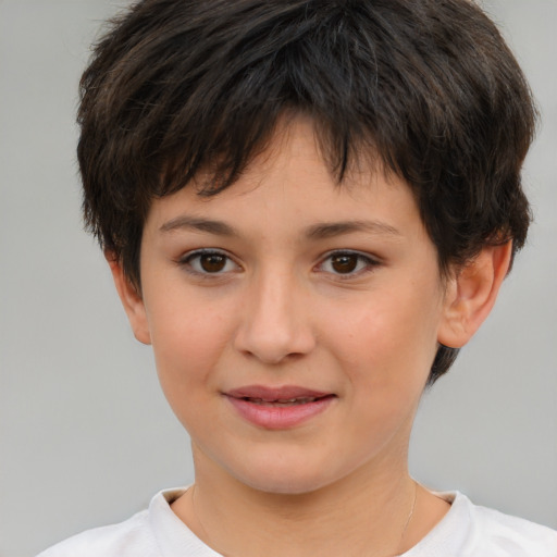 Joyful white child female with short  brown hair and brown eyes
