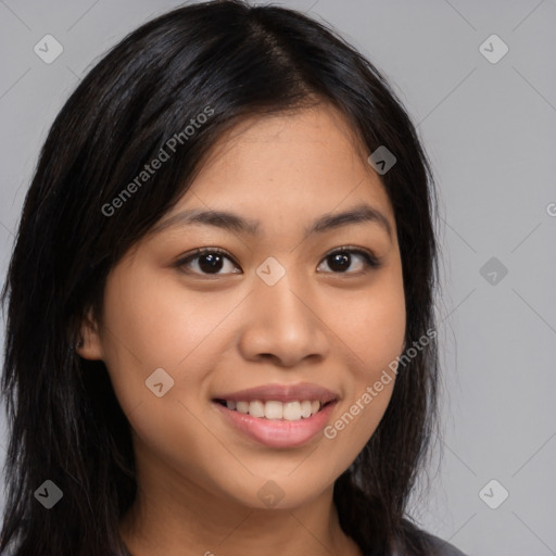 Joyful latino young-adult female with long  brown hair and brown eyes