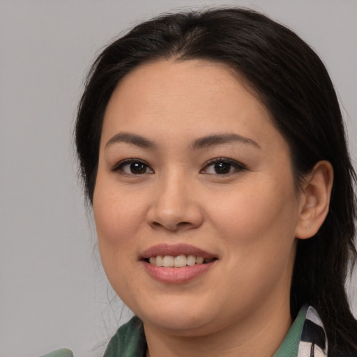 Joyful white young-adult female with medium  brown hair and brown eyes