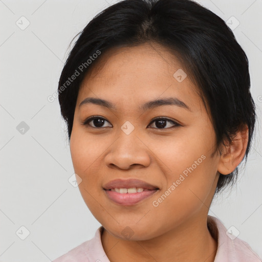 Joyful asian young-adult female with medium  black hair and brown eyes