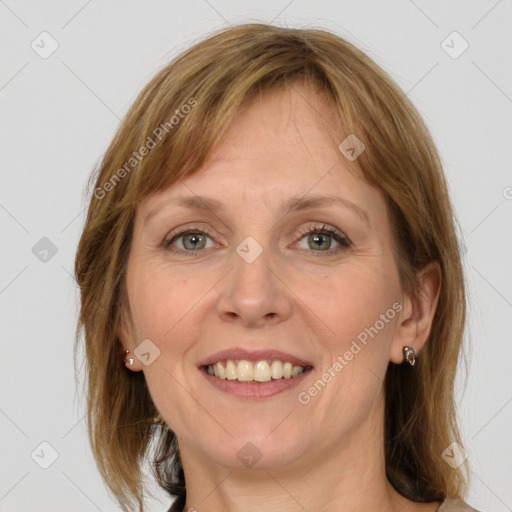 Joyful white adult female with medium  brown hair and grey eyes