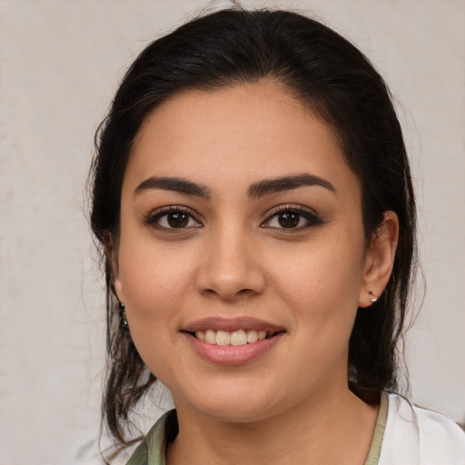 Joyful white young-adult female with medium  brown hair and brown eyes