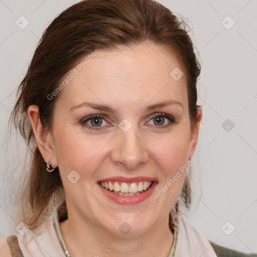 Joyful white young-adult female with medium  brown hair and blue eyes