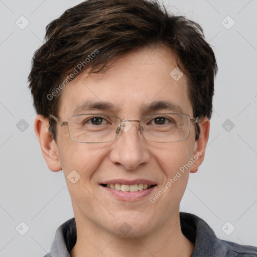 Joyful white adult male with short  brown hair and grey eyes