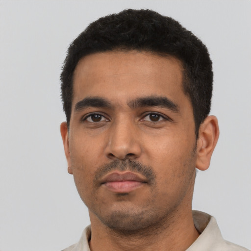 Neutral latino young-adult male with short  black hair and brown eyes