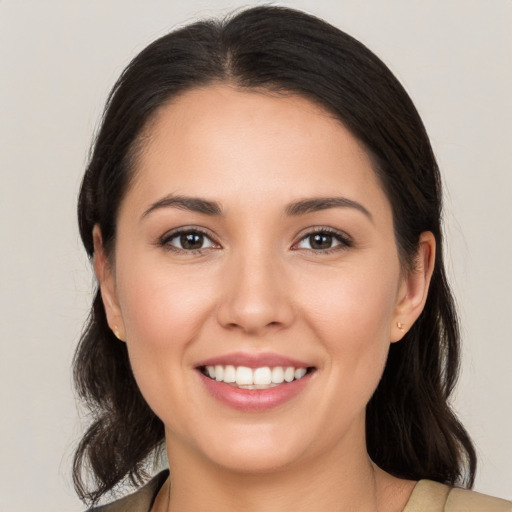 Joyful white young-adult female with medium  brown hair and brown eyes