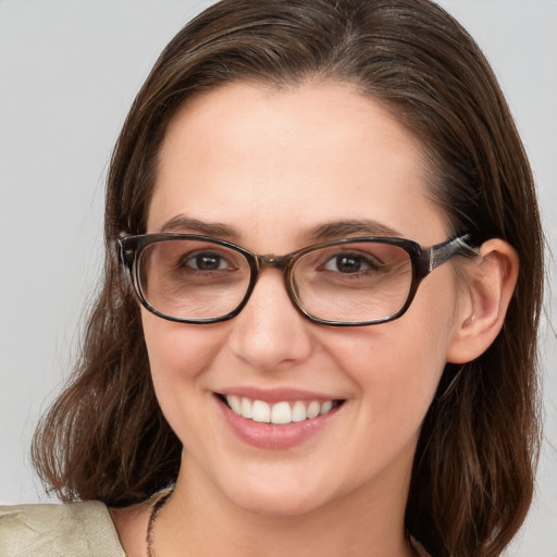 Joyful white young-adult female with medium  brown hair and blue eyes