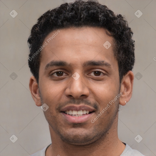 Joyful white young-adult male with short  black hair and brown eyes