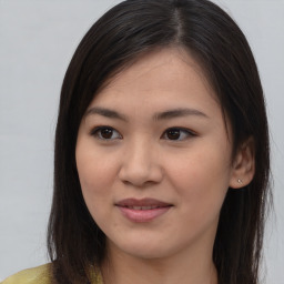 Joyful asian young-adult female with long  brown hair and brown eyes