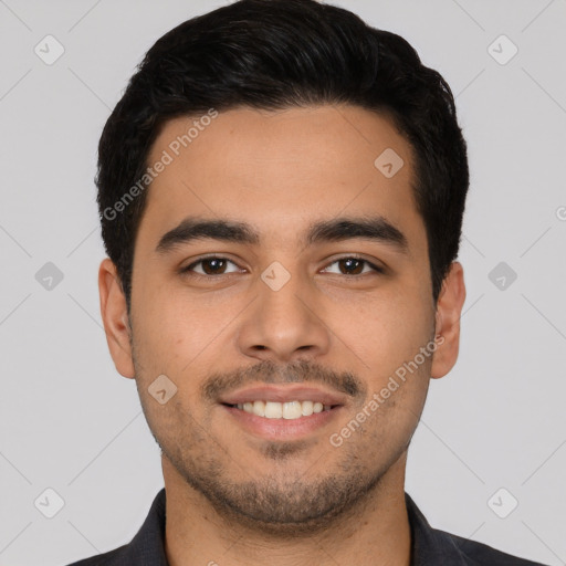 Joyful latino young-adult male with short  black hair and brown eyes