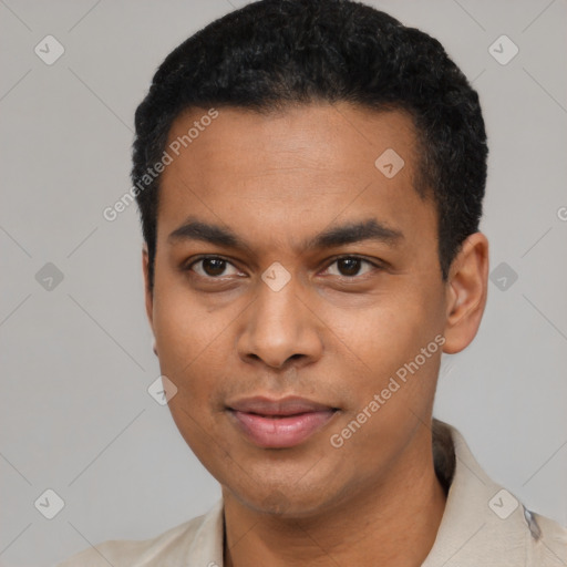 Joyful latino young-adult male with short  black hair and brown eyes