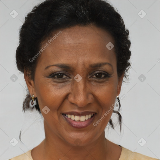 Joyful black adult female with short  brown hair and brown eyes