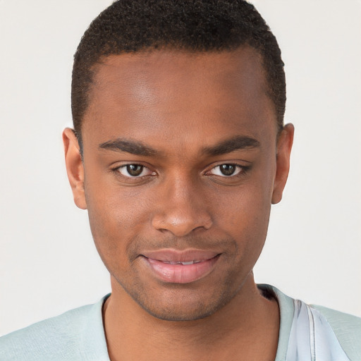 Joyful black young-adult male with short  brown hair and brown eyes