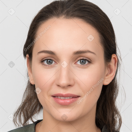 Joyful white young-adult female with medium  brown hair and grey eyes