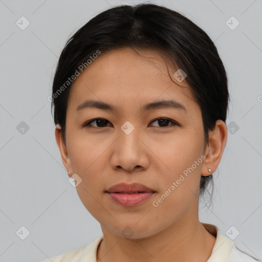 Joyful asian young-adult female with short  black hair and brown eyes