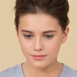 Joyful white child female with short  brown hair and brown eyes