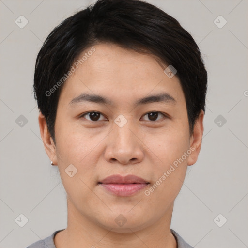 Joyful asian young-adult male with short  black hair and brown eyes