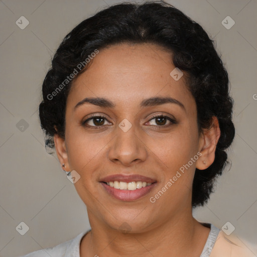 Joyful latino young-adult female with short  black hair and brown eyes