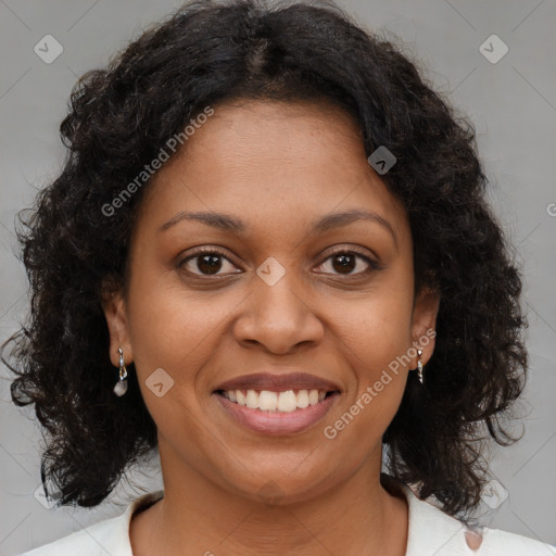 Joyful black young-adult female with medium  brown hair and brown eyes