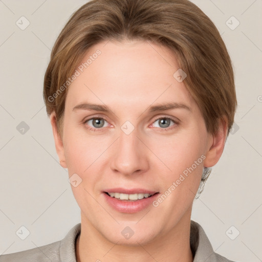 Joyful white young-adult female with short  brown hair and grey eyes