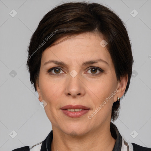 Joyful white adult female with medium  brown hair and brown eyes