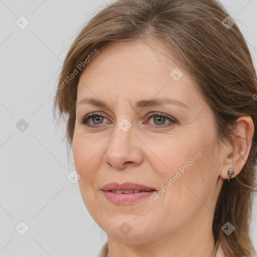 Joyful white adult female with long  brown hair and brown eyes