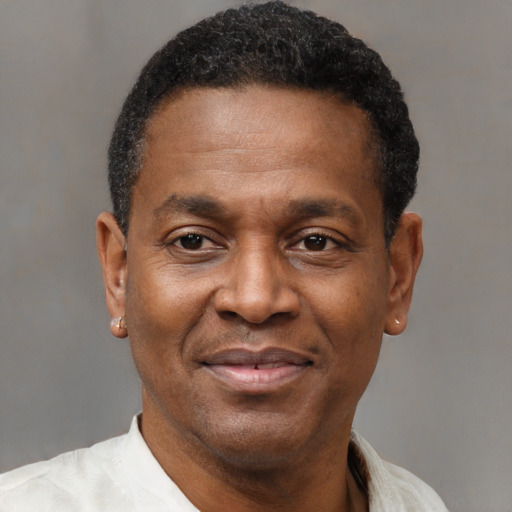 Joyful latino adult male with short  black hair and brown eyes