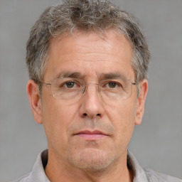 Neutral white middle-aged male with short  brown hair and brown eyes