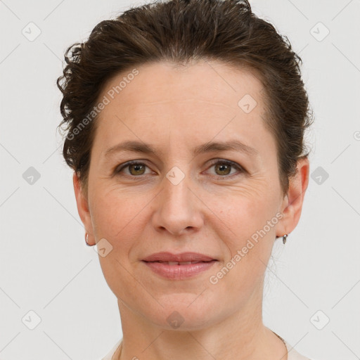 Joyful white adult female with short  brown hair and grey eyes