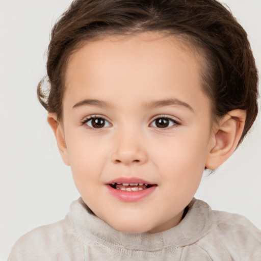 Joyful white child female with short  brown hair and brown eyes