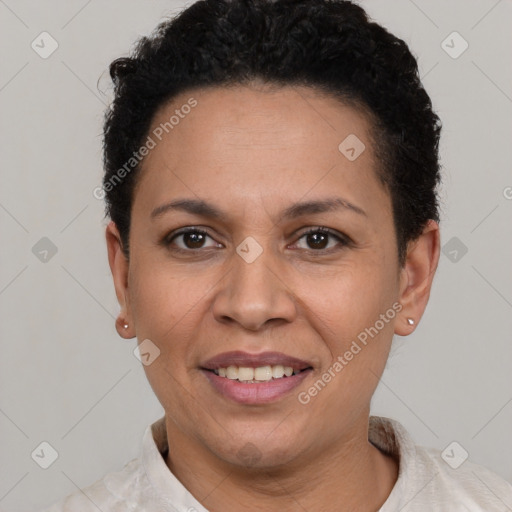 Joyful latino adult female with short  brown hair and brown eyes