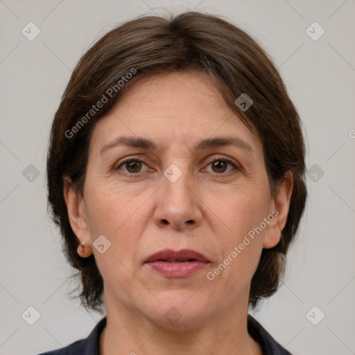 Joyful white adult female with medium  brown hair and grey eyes