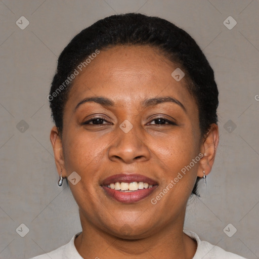 Joyful latino adult female with short  brown hair and brown eyes