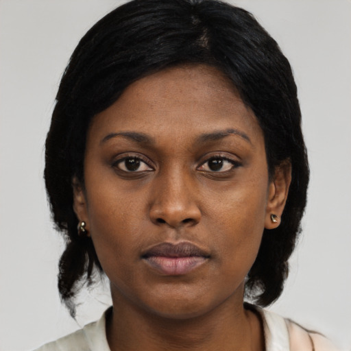 Neutral black young-adult female with medium  black hair and brown eyes