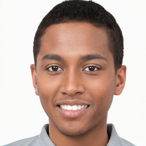 Joyful black young-adult male with short  brown hair and brown eyes