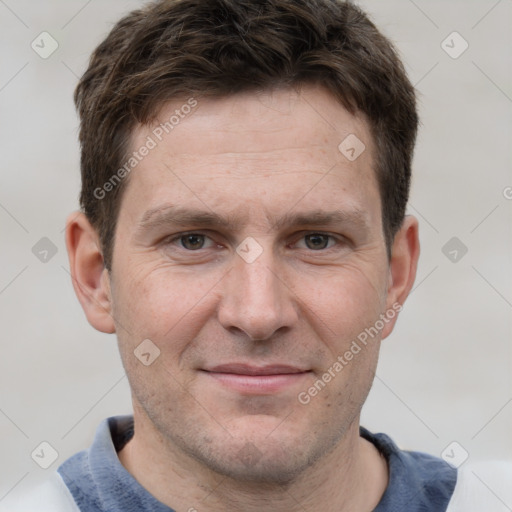 Joyful white adult male with short  brown hair and grey eyes