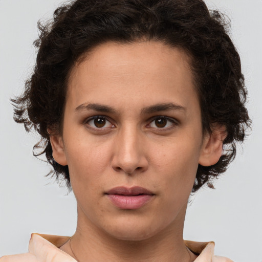 Neutral white young-adult female with short  brown hair and brown eyes