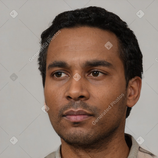 Neutral latino young-adult male with short  black hair and brown eyes