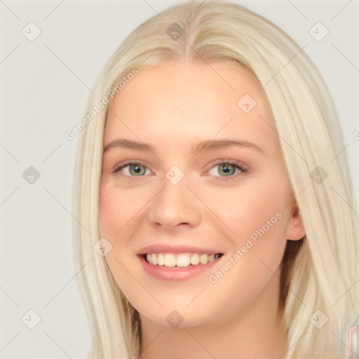 Joyful white young-adult female with long  brown hair and blue eyes