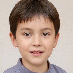 Joyful white child male with short  brown hair and brown eyes