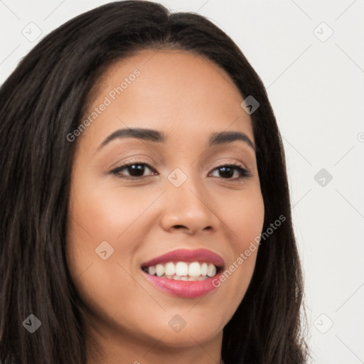 Joyful latino young-adult female with long  brown hair and brown eyes