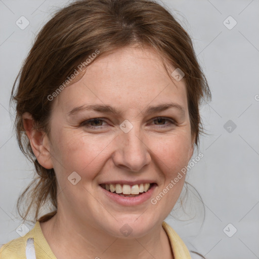 Joyful white young-adult female with medium  brown hair and blue eyes