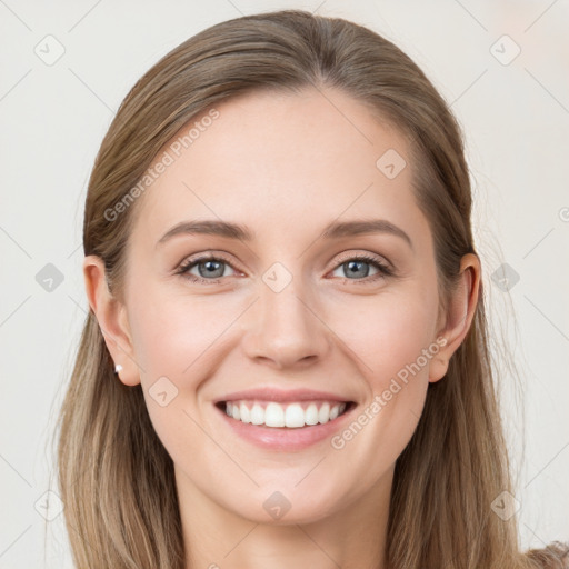 Joyful white young-adult female with long  brown hair and grey eyes