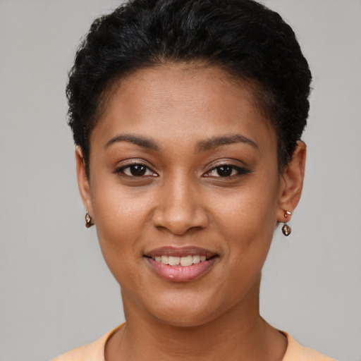 Joyful latino young-adult female with short  brown hair and brown eyes