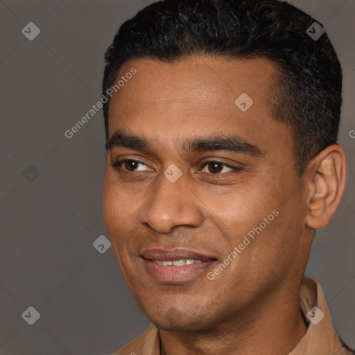 Joyful latino young-adult male with short  black hair and brown eyes