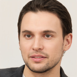 Joyful white young-adult male with short  brown hair and brown eyes