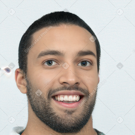 Joyful white young-adult male with short  black hair and brown eyes