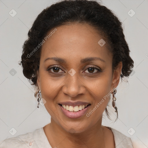 Joyful black adult female with short  brown hair and brown eyes